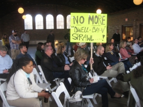 During the neighborhood meeting one resident held a sign that said, 