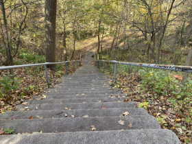 Steps leading to the trail by the river