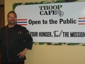 Greg Bautista, Head Chef, helps promote Troop Café’s slogan: Feed Your Hunger, Fuel The Mission.