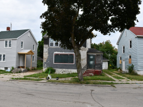Initiative Home (left), abandoned home (middle), privately-owned home (right)