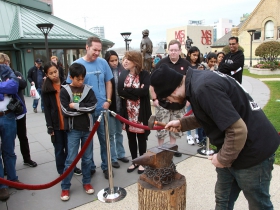 Blacksmithing demonstration on the Grohmann Museum rooftop. Photo by Erol Reyal