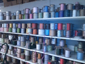 Ribbon stacked on shelves.