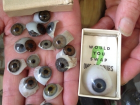 Rudig shows off her collection of glass eyes. Photo by Joe Horning.