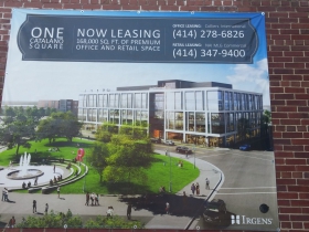 Plans are to replace the building that the sign is on with the building in the picture