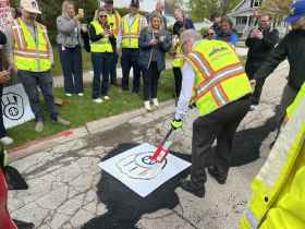 Rick Schlesinger Applies Brewers Stencil to Pothole