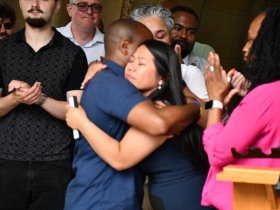 Mayor Cavalier Johnson Hugs Diana Vang-Brostff After Signing Housing Legislation