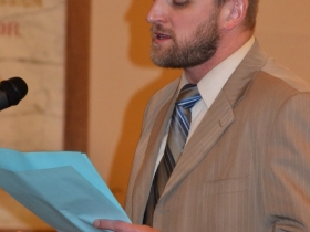 Alderman Kovac reads his poem titled, Vote for the Vowels.