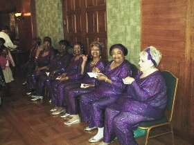 These women in purple are getting ready to put on a show for their Congressman, Gwen Moore.