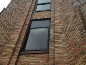 The brick facade of the Gas Light Building.
