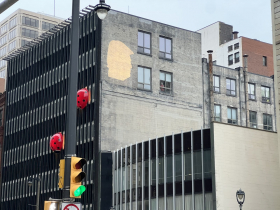 Trump Bat Signal on Ladybug Building