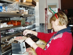 Dawn Andrade Weighing Sandwich Meat Portions. Photo by Peggy Schulz.