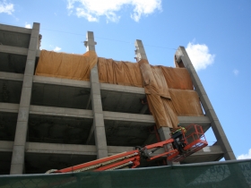Demolition of the parking structure at W. Wells and N. 6th streets.