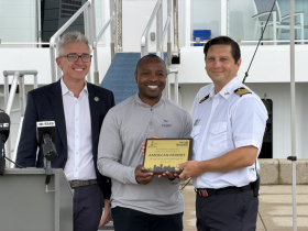 Ald. Peter Burgelis, Mayor Cavalier Johnson Present Plaque to Capt. Jerry Smith, Jr.