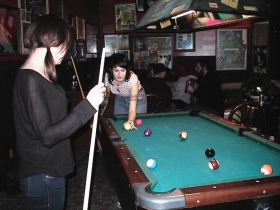 Angela Smolinski and Nicole La Brie playing pool.