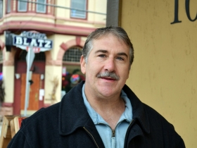 Frank stands at Astor and Brady, home to Brady Street anchors Gloriosos and the Roman Coin