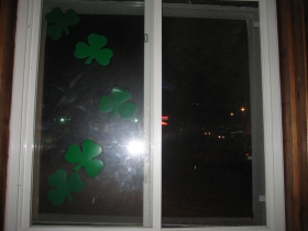 That is N. Water St. to the south as seen through this shamrock-festooned window at The Curve Bar.