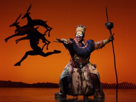 Brown Lindiwe Mkhize as Rafiki in the opening number The Circle of Life from THE LION KING National Tour.