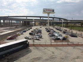 Parking lot separates St. Paul Avenue and the former St. Paul Railroad tracks