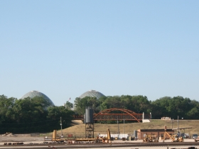 A view of one of the new bridges at Three Bridges Park, with the Domes in the background.