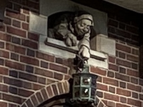 Gargoyle welcoming guests above front entrance