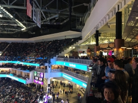 Fans hang out and watch the game from the top level draught house.