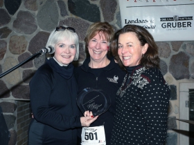 Marybeth Budisch (l) and Kristine Cleary (r) accept the Biggest Heart trophy from Cullen Run/Walk Chair Gael Cullen on behalf of the Cardiovascular Center Advisory Board. The Board won the trophy for raising over $12,600 for heart research for the 23rd Annual Steve Cullen Healthy Heart Run/Walk