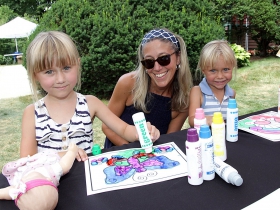 Cecilia, Christine and Clara from Wauwatosa, WI at the Ruckus & Glee booth at the Firefly Art Fair children's area