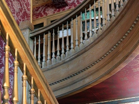 Grand staircase at the Wauwatosa Historical Society Kneeland-Walker Museum & Preservation Center