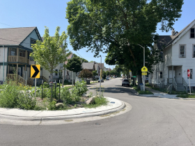 Traffic Circle and, in background, Pinned On Curb Bump-outs at W. Scott Street and S. 20th Street