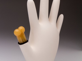 “Thumbsucker” by Samuel Davis. Porcelain and chew toy, 2013.