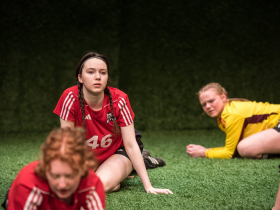 Josie Van Slyke as #13, Reiley Fitzsimmons as #46 and Elena Marking at #00 in Renaissance Theaterworks’ production of THE WOLVES by Sarah DeLappe.  Photo by Ross Zentner.