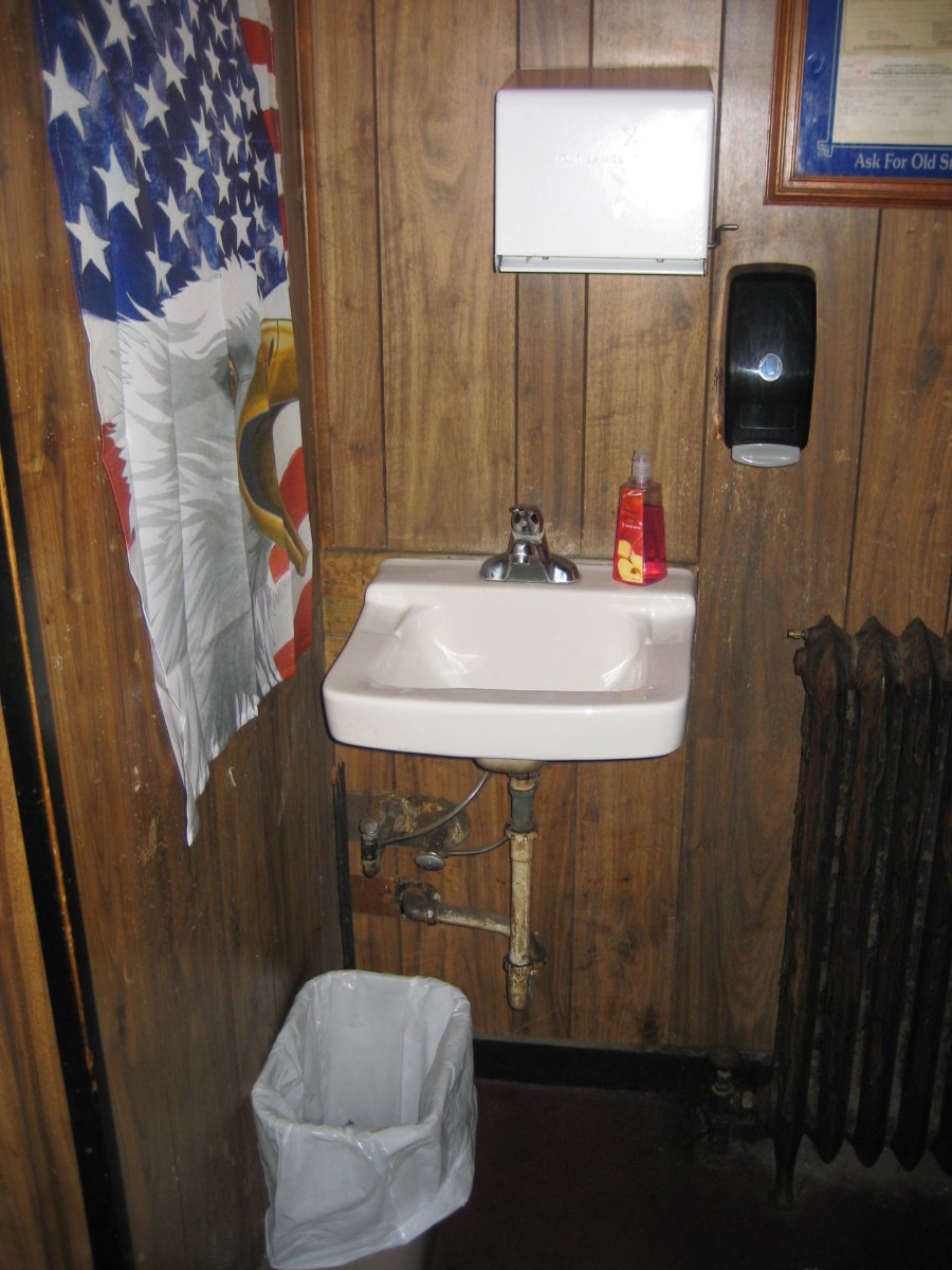 Old school -- hand washing station lets you keep up with doings at the bar while you scrub your mitts