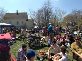 Panoramic view of bicyclists waiting to register for the Riverwest 24.