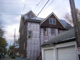 Alley house in Riverwest with solar panels.