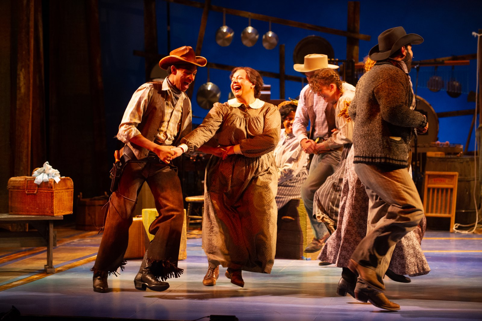 Sean Anthony Jackson (Will Parker) and SaraLynn Evenson (Kate), center, in Skylight Music Theatre’s production of Oklahoma! September 27 – October 13.