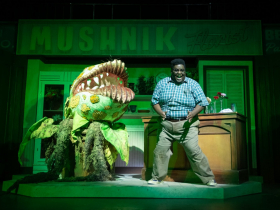 Kevin James Sievert (Seymour) in Skylight Music Theatre’s production of Little Shop of Horrors running November 19, 2021 - January 2, 2022. (Editor’s Note: Audrey II Puppeteer - Gabriella Ashlin. Audrey II Voice - Aaron Reese Boseman).