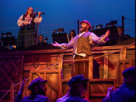 (I. to r.) Kimberly Hanson (The Fiddler) and Andrew Varela (Tevye) in Skylight Music Theatre’s production of Fiddler on the Roof running October 3-26, 2025.