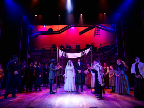 (I. to r.) Andrew Varela (Tevye), Erin Fricker (Tzeitel), Grayson Buesing (Motel), John Schneider (Rabbi), Janet Metz (Golde), and cast in Skylight Music Theatre’s production of Fiddler on the Roof running October 3-26, 2025.