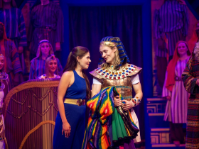 Laura Paruzynski as the Narrator and Mason Hanizeski as Joseph in Skylight Music Theatre’s production of Joseph and the Amazing Technicolor® Dreamcoat, running November 14 through December 28, 2025