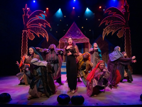 Samantha Sostarich as Dan, Joshua Thone as Gad, Jesse Weinberg as Reuben, Ciara Hart as Zebulon, Laura Paruzynski as the Narrator (center), Shawn Holmes as Judah, Matt Zeman as Naphtali, Rachel Bednarowski as Issachar, Jake Horstmeier as Simeon, and Matthew Torkilsen as Benjamin in Skylight Music Theatre’s production of Joseph and the Amazing Technicolor® Dreamcoat, running November 14 through December 28, 2025.