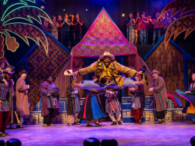 Shawn Holmes as Judah (center), (back line) William Toney as Asher, Matthew Torkilsen as Benjamin, Joshua Thone as Gad, Ciara Hart as Zebulon, Jake Horstmeier as Simeon, Matt Zeman as Naphtali, Hope Riesterer as Ensemble, (Youth Ensemble left, front line) Selene Taylor, Adelynn Bosnak, Ellory Woodford, Mac Heinrich, (left, back line) Memphis Cook, Elias Totleben, (right, front line) Isabella Zakrzewski, Shaun Martin, Averi Lauren Grier, Emily Dalecky (right, back line) Rohan Rhys, and Steven Gayfield in Skylight Music Theatre’s production of Joseph and the Amazing Technicolor® Dreamcoat, running November 14 through December 28, 2025