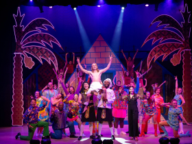 (I to r front line) Matt Zeman as Butler, Mason Hanizeski as Joseph (center), William Toney as Baker, Laura Paruzynski as the Narrator, and the cast in Skylight Music Theatre’s production of Joseph and the Amazing Technicolor® Dreamcoat, running November 14 through December 28, 2025