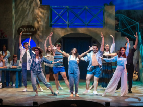 Lisa Estridge (Donna Sheridan, center) and the cast of Mamma Mia! in Skylight Music Theatre’s production of Mamma Mia! running September 23 – October 16, 2022.