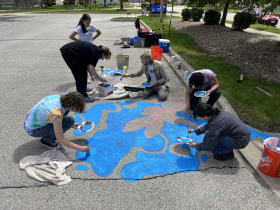 ArtWorks for Milwaukee high school interns designed and painted several pavement murals surrounding the storm drains at Samuel Clemens Elementary School