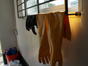 Gloves hang inside Rapid Radicals’ Torrent3 containerized system