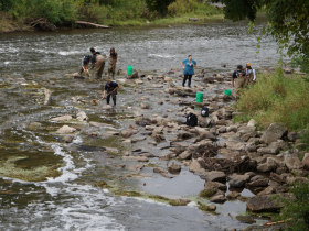 Seventh graders from Glen Hills Middle School work with a team from Milwaukee County Parks to survey the Milwaukee River downstream of Kletzsch Dam in September 2023