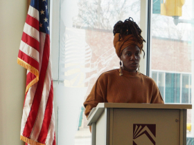 Poet Shana Wilson, who performs with the name Blue Lotus, offered opening remarks at the panel discussion, “Climate Justice, Our Planet, Our Survival,” held at the Villard Square Branch of the Milwaukee Public Library on March 9, 2024