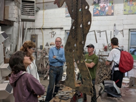 Artist Richard Taylor shows FOHAST and HAST trail manager progress on the first to sculptures out of five