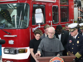 Father Bede Thigpen blesses Engine Company 31 fire house