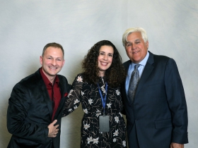 Neil Willenson, Co-Founder of Camp Reunite/Camp Hometown Heroes, Adria Willenson, Director of the Friendship Art Studio and Jay Leno.